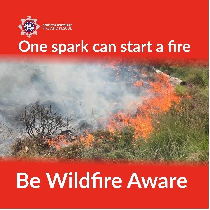 Wildfire warning Picture of a wildfire with text one spark can start a fire. Be wildfire aware.